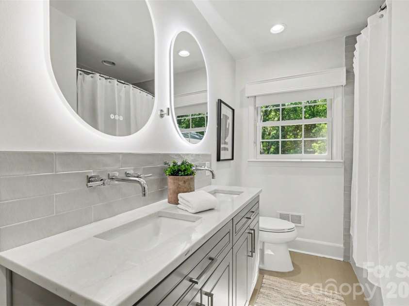 7010 Terrace Drive, Charlotte, NC 28211.  MLS# CAR4358839, YatesRealty ID 20519. New hall full bathroom dual sinks and touch light mirrors