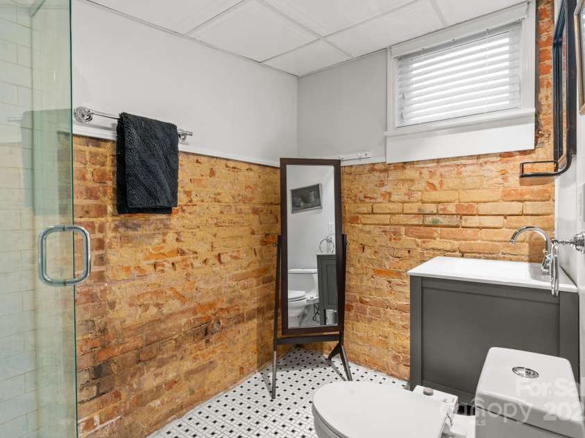 5 Chiles Avenue, Asheville, NC 28803.  MLS# CAR4219140, YatesRealty ID 20523. Basement Bathroom Feels like a Soho Loft