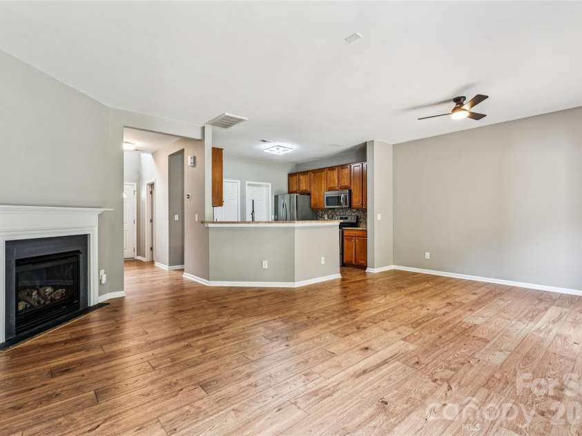 11961 Stratfield Place Circle, Pineville, NC 28134.  MLS# CAR4379455, YatesRealty ID 20527. Living Room facing Kitchen