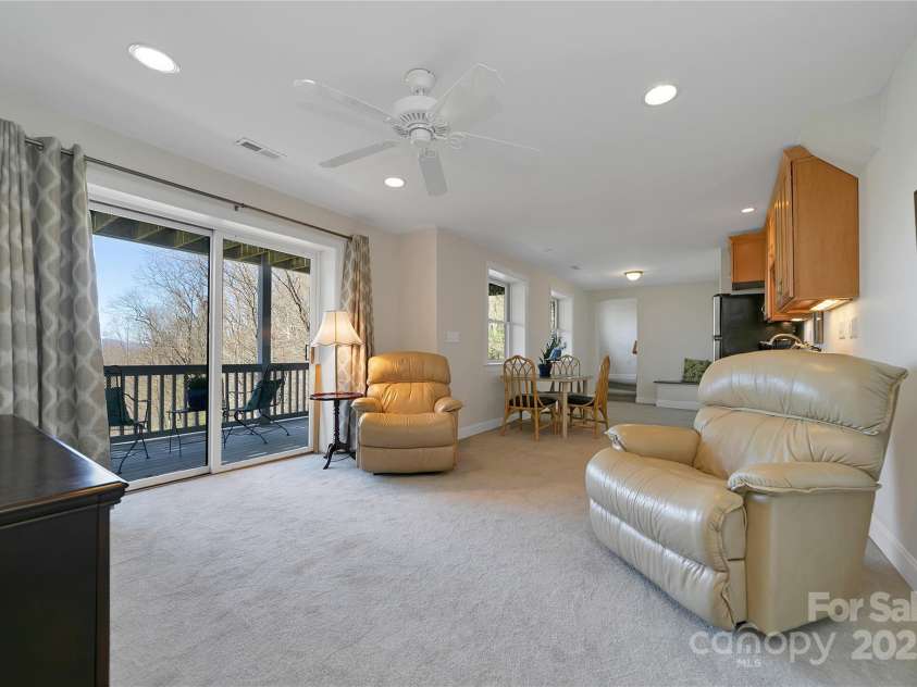 2600 Connestee Trail, Brevard, NC 28712.  MLS# CAR4235647, YatesRealty ID 20535. Lower level living room