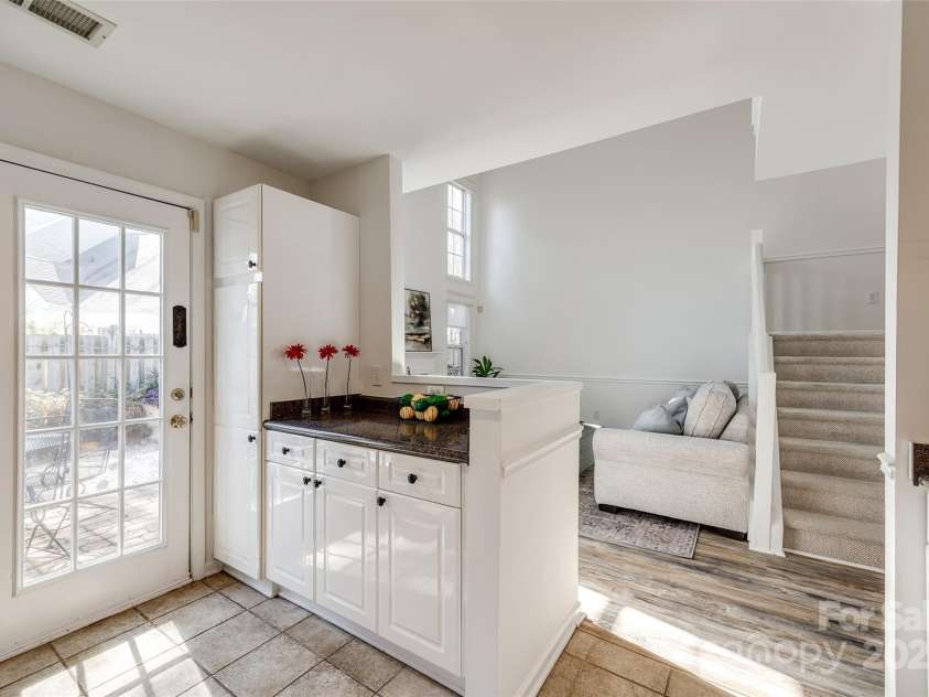 8929 Bryant Field Circle, Charlotte, NC 28277.  MLS# CAR4226724, YatesRealty ID 2054. Kitchen - door to back patio & garden