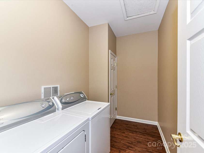 10727 Ryan Courtney Square, Mint Hill, NC 28227.  MLS# CAR4252287, YatesRealty ID 20546. Full laundry room includes a dedicated storage closet and ample space for organization, making everyday chores more efficient and convenient.