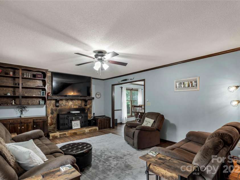 3547 Willowood Pond Drive, Rock Hill, SC 29730.  MLS# CAR4270729, YatesRealty ID 20555. Living room with wood burning fireplace