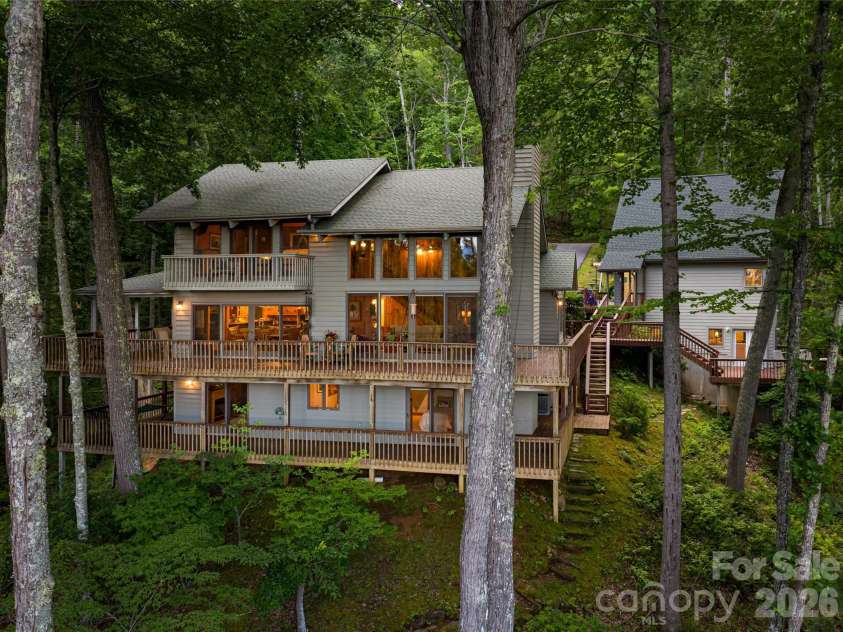 163 Tweetys Knoll, Burnsville, NC 28714.  MLS# CAR4281512, YatesRealty ID 2056. 3 levels of mountain oasis PLUS guest house on nearly 12 acres of privacy