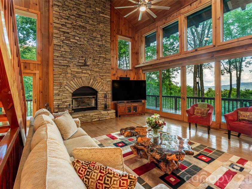 163 Tweetys Knoll, Burnsville, NC 28714.  MLS# CAR4281512, YatesRealty ID 2056. Dramatic floor to ceiling stone fireplace