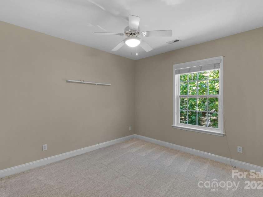 3017 Chisholm Court, Waxhaw, NC 28173.  MLS# CAR4234747, YatesRealty ID 20561. Comfortable guest or secondary bedroom with a full bath accessible via the adjoining bonus room-perfect for teens, guests or multi generational living!