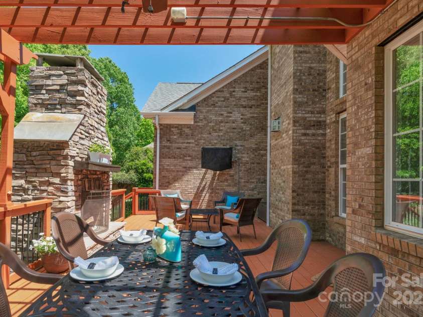 3017 Chisholm Court, Waxhaw, NC 28173.  MLS# CAR4234747, YatesRealty ID 20561. Enjoy dining outside under the pergola with room for everyone!