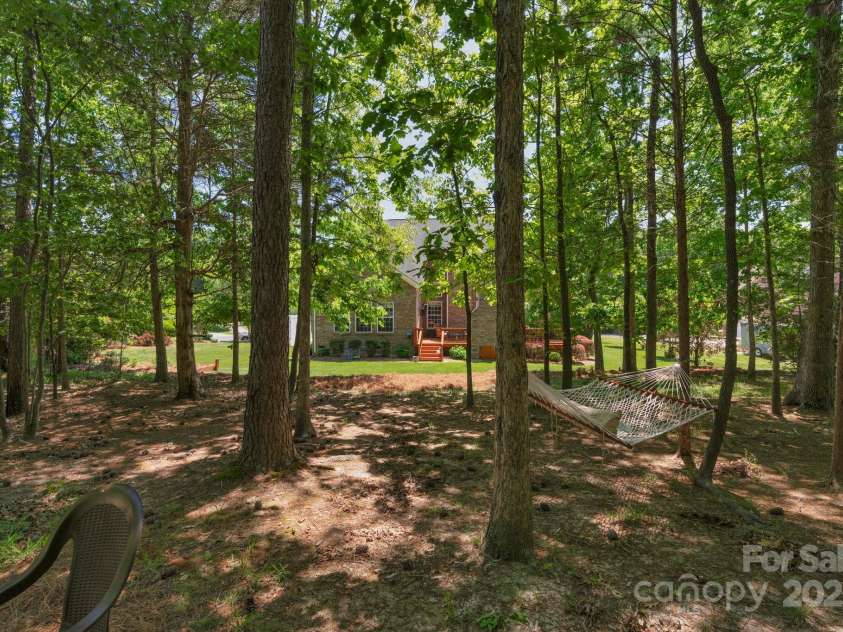 3017 Chisholm Court, Waxhaw, NC 28173.  MLS# CAR4234747, YatesRealty ID 20561. Large wooded area provides shade on those warm summer days