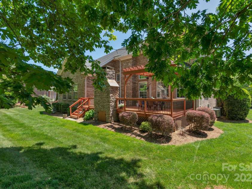 3017 Chisholm Court, Waxhaw, NC 28173.  MLS# CAR4234747, YatesRealty ID 20561. Oversized flat lot with mature trees