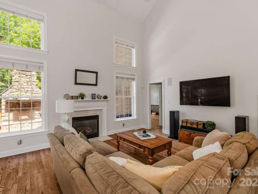 3017 Chisholm Court, Waxhaw, NC 28173.  MLS# CAR4234747, YatesRealty ID 20561. Spacious and light-filled great room with dramatic vaulted ceilings, gas fireplace and beautiful hardwood floors.