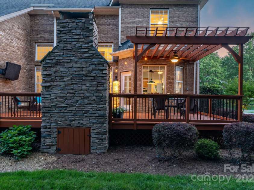 3017 Chisholm Court, Waxhaw, NC 28173.  MLS# CAR4234747, YatesRealty ID 20561. Stacked stone outdoor fireplace is great for entertaining, making s'mores or just relaxing outside!