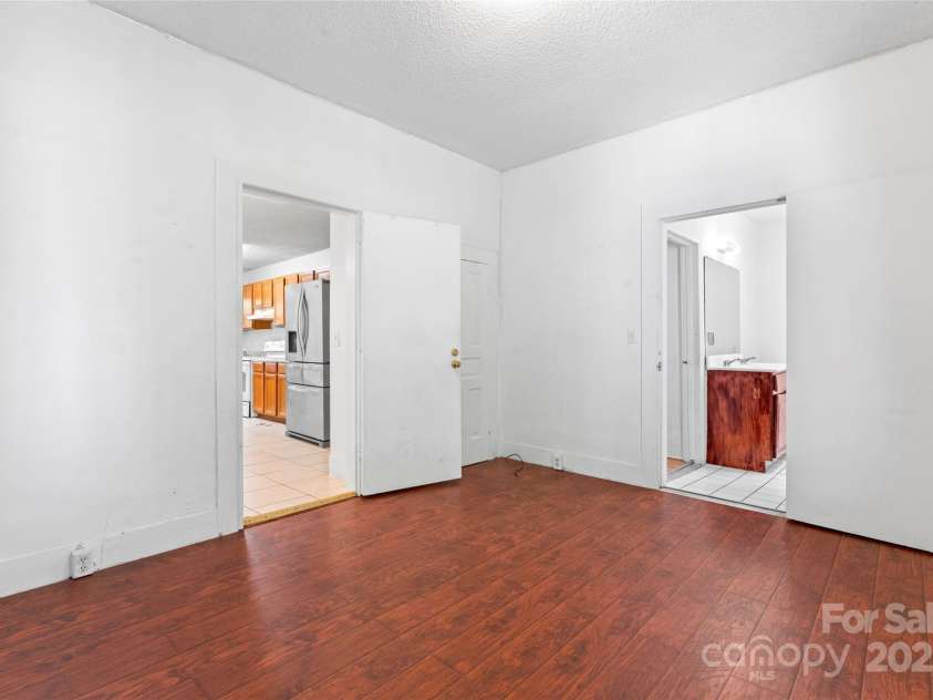 317 Campus Street, Charlotte, NC 28216.  MLS# CAR4329279, YatesRealty ID 20564. Bedroom 3 is connected to the bath