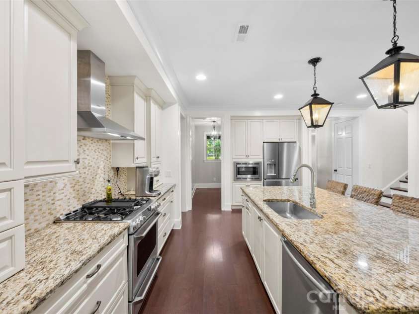 8624 Robbins Crescent Drive, Cornelius, NC 28031.  MLS# CAR4410622, YatesRealty ID 20564. Large open kitchen and island with butlers pantry