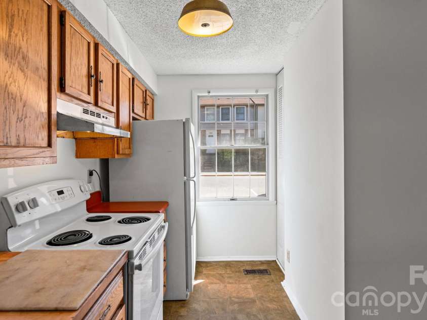 7344 Pebblestone Drive, Charlotte, NC 28212.  MLS# CAR4378230, YatesRealty ID 20570. Convenient Pantry Storage