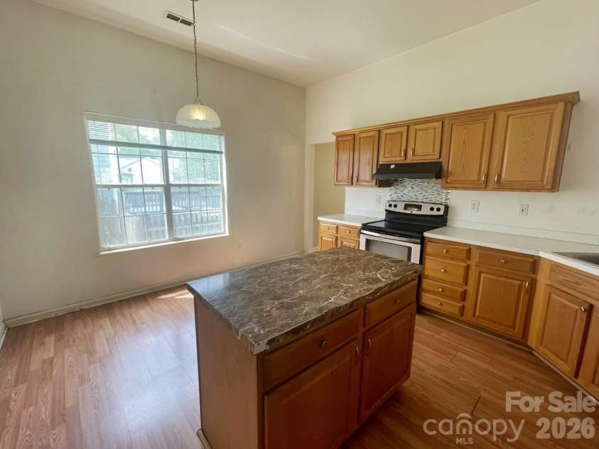 8418 Red Cypress Court, Charlotte, NC 28216.  MLS# CAR4379114, YatesRealty ID 20571. Kitchen Angle 2