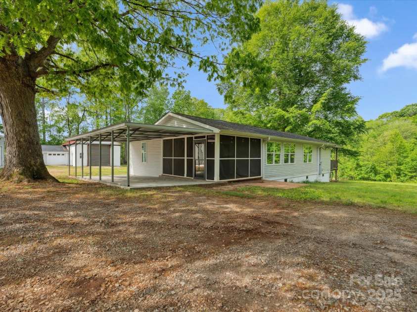 195 Bluebird Lane, Salisbury, NC 28146.  MLS# CAR4259402, YatesRealty ID 20581. Front of home from gate