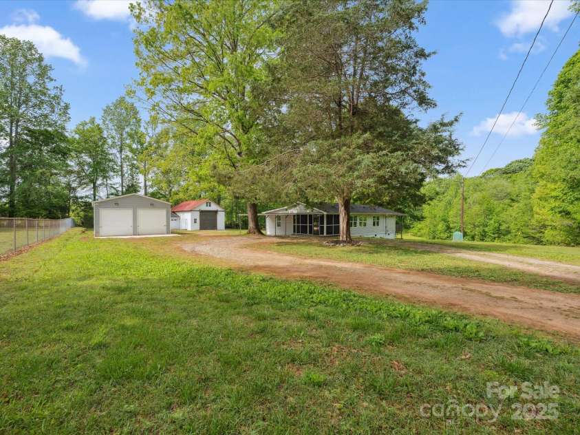 195 Bluebird Lane, Salisbury, NC 28146.  MLS# CAR4259402, YatesRealty ID 20581. House and yard