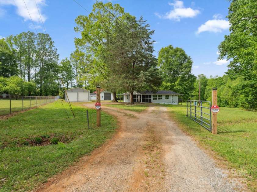 195 Bluebird Lane, Salisbury, NC 28146.  MLS# CAR4259402, YatesRealty ID 20581. House and yard from Gate