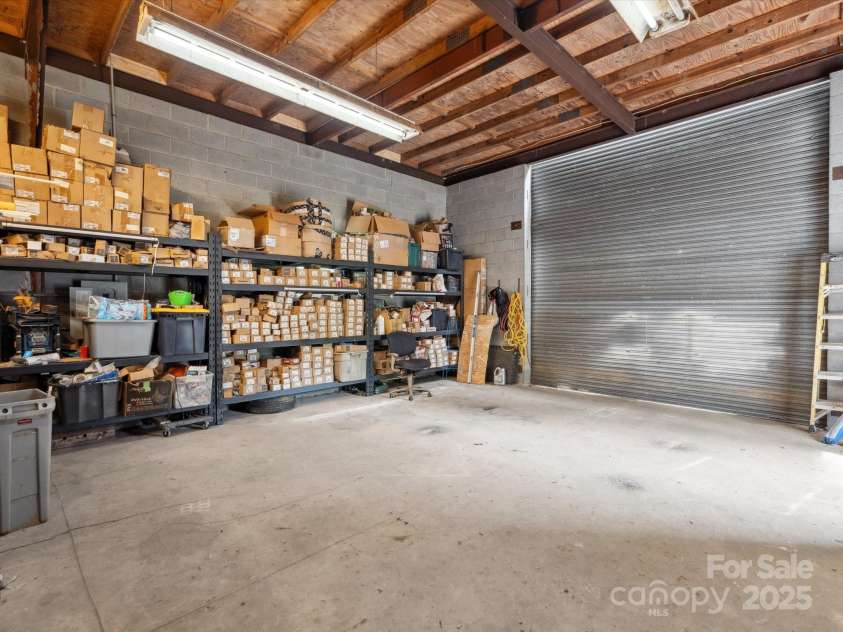 195 Bluebird Lane, Salisbury, NC 28146.  MLS# CAR4259402, YatesRealty ID 20581. Inside 2 story white garage