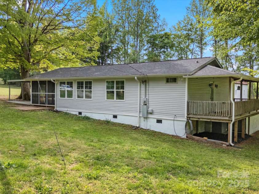 195 Bluebird Lane, Salisbury, NC 28146.  MLS# CAR4259402, YatesRealty ID 20581. Side of home and full back porch