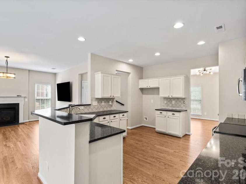 7934 Harbor Ridge Court, Denver, NC 28037.  MLS# CAR4374308, YatesRealty ID 20581. Granite counters in the kitchen, freshly refinished floors, all new paint, this kitchen space is huge and there is a a pantry too!