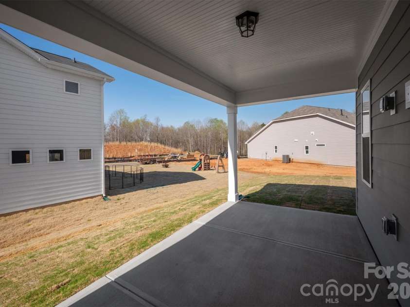 2234 Camber Drive, Gastonia, NC 28054.  MLS# CAR4314341, YatesRealty ID 20587. Rear Covered Patio