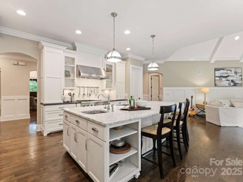 408 Covington Crossing, Matthews, NC 28104.  MLS# CAR4272169, YatesRealty ID 20589. The large kitchen island is great for meal prepping.