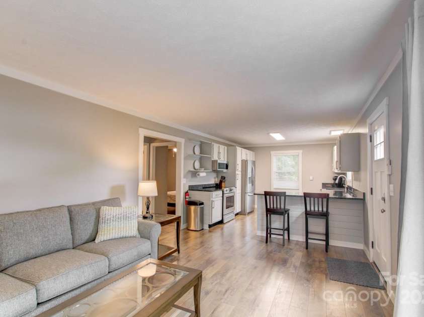 180 Ellerslie Acre None, Hendersonville, NC 28739.  MLS# CAR4270552, YatesRealty ID 20594. Living area/kitchen of 2nd living quarters