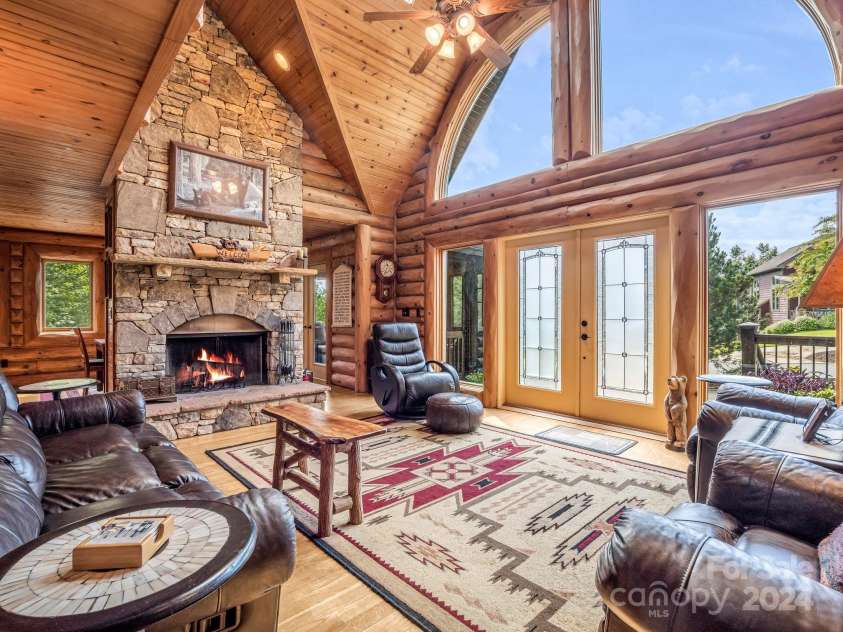 181 Highland Heights, Lake Lure, NC 28746.  MLS# CAR4183950, YatesRealty ID 206. Great Room w stone fireplace
