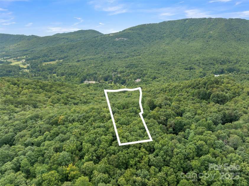 812 Crab Creek Road, Hendersonville, NC 28739.  MLS# CAR4313649, YatesRealty ID 206. Aerial view from back of property, boundary is not official survey