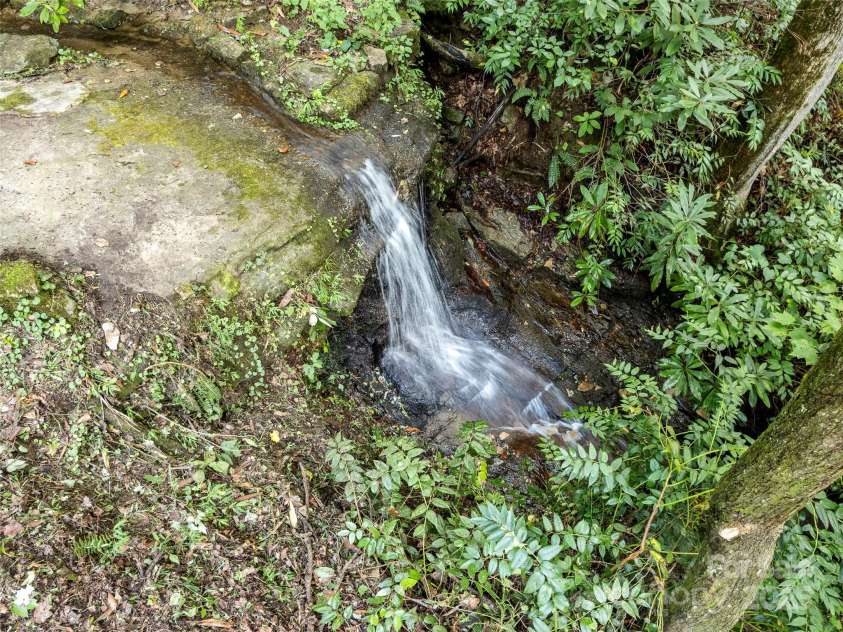 812 Crab Creek Road, Hendersonville, NC 28739.  MLS# CAR4313649, YatesRealty ID 206. Natural waterfall