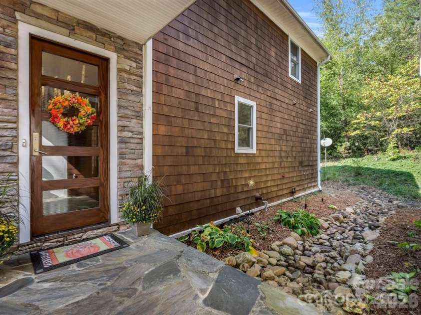 167 Trails End, Lake Lure, NC 28746.  MLS# CAR4245504, YatesRealty ID 2060. Front Door covered by 'link'