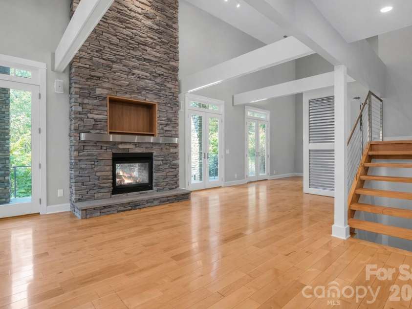 167 Trails End, Lake Lure, NC 28746.  MLS# CAR4245504, YatesRealty ID 2060. GR w/see-thru FP - Lots of natural light