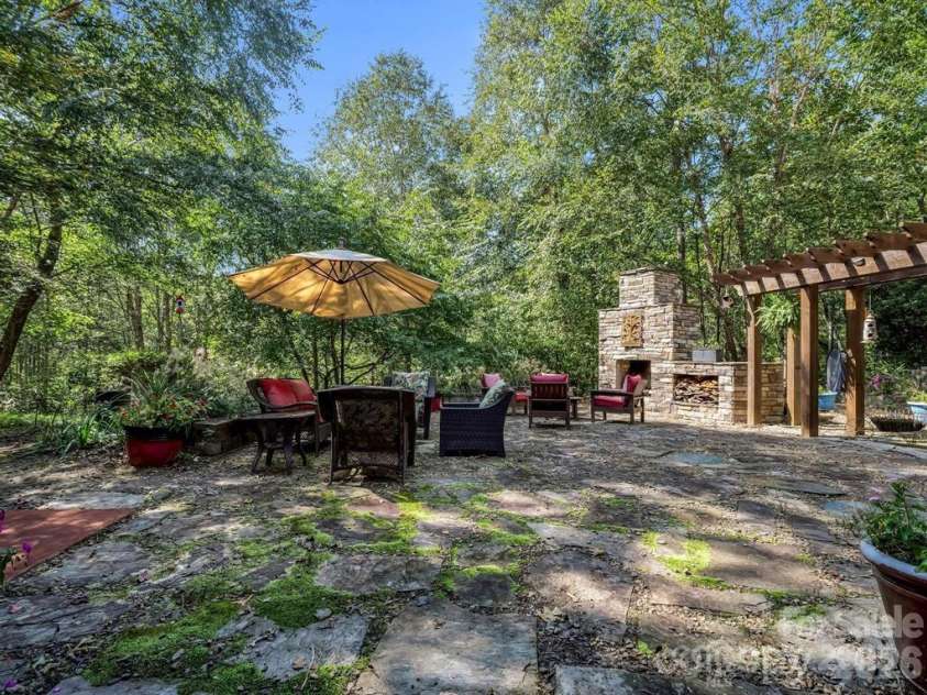 167 Trails End, Lake Lure, NC 28746.  MLS# CAR4245504, YatesRealty ID 2060. Privacy galore w/outdoor fireplace