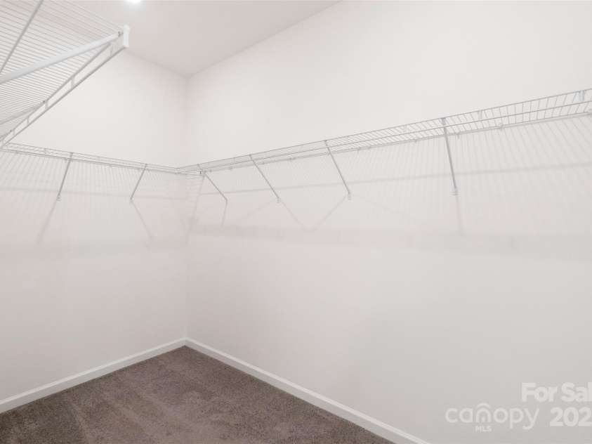 117 Carmine Court, Troutman, NC 28166.  MLS# CAR4269982, YatesRealty ID 20601. Huge walk-in closet in downstairs primary bedroom