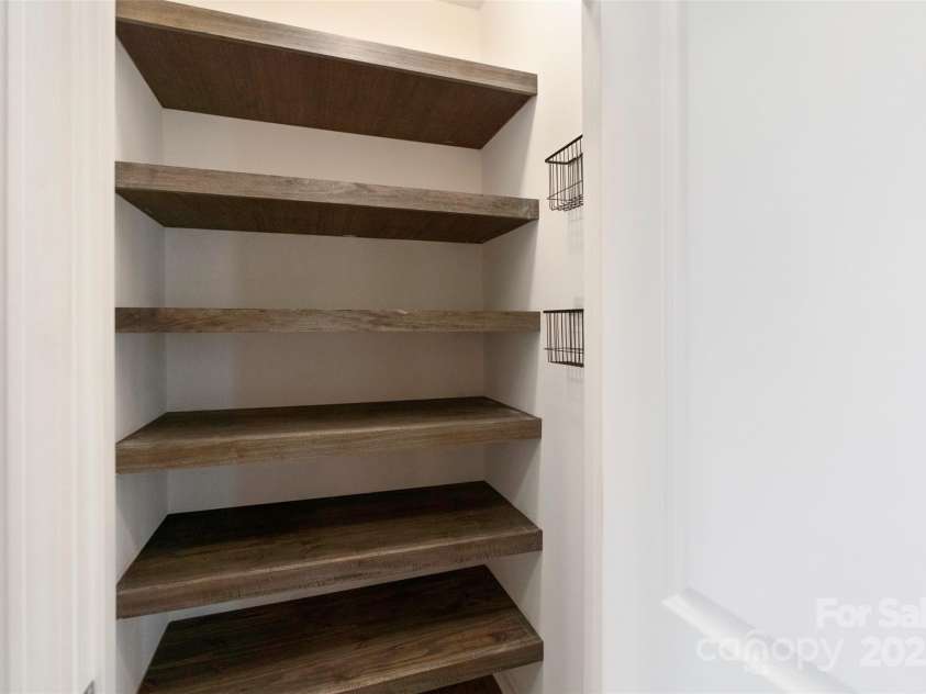 117 Carmine Court, Troutman, NC 28166.  MLS# CAR4269982, YatesRealty ID 20601. Upgraded custom shelving in pantry