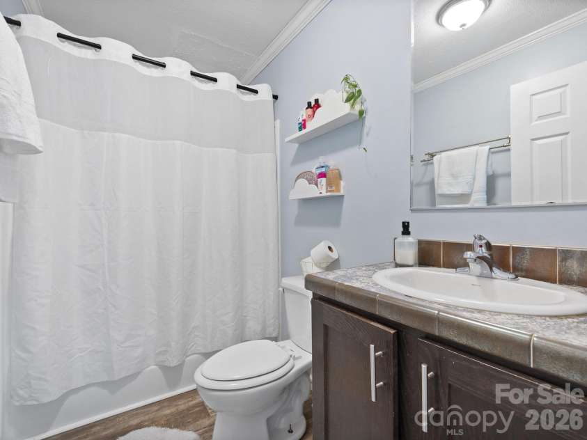 191 Posey Griffin Drive, Mars Hill, NC 28754.  MLS# CAR4374358, YatesRealty ID 20601. 2nd bathroom between the two guest bedrooms.