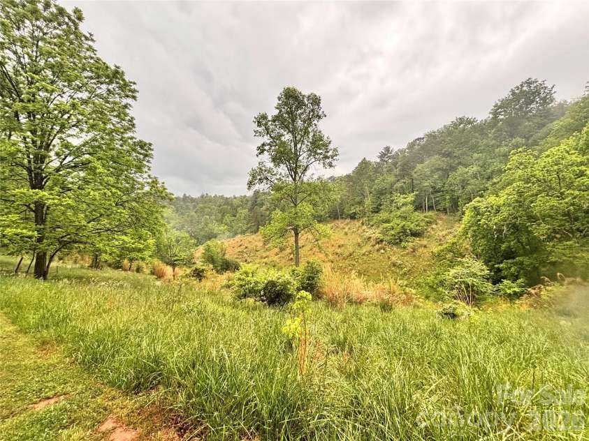 191 Posey Griffin Drive, Mars Hill, NC 28754.  MLS# CAR4374358, YatesRealty ID 20601. So many possibilities on this 4.38 acre tract in which this home is situated!