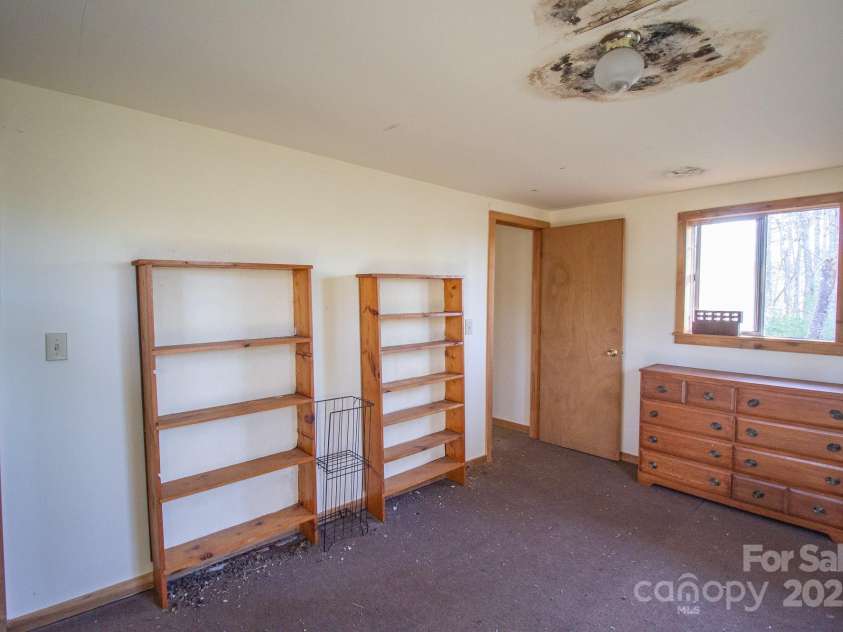 691 Sandy Bottom Road, Marshall, NC 28753.  MLS# CAR4272745, YatesRealty ID 20602. Back Bedroom