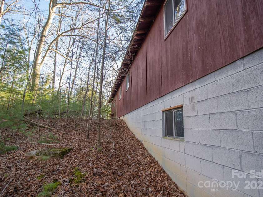 691 Sandy Bottom Road, Marshall, NC 28753.  MLS# CAR4272745, YatesRealty ID 20602. Back of Cabin