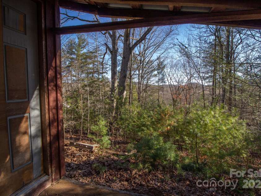 691 Sandy Bottom Road, Marshall, NC 28753.  MLS# CAR4272745, YatesRealty ID 20602. Front Porch Winter View