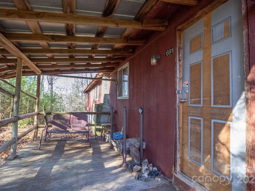 691 Sandy Bottom Road, Marshall, NC 28753.  MLS# CAR4272745, YatesRealty ID 20602. Porch