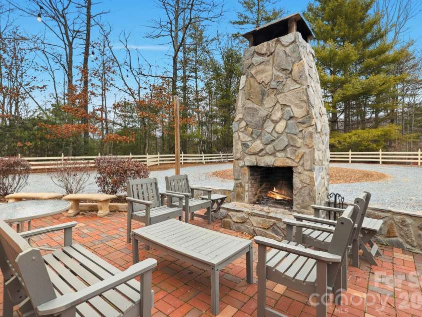 1644 Broadstone Road, Banner Elk, NC 28604.  MLS# CAR4349830, YatesRealty ID 2061. Outside terrace with impressive fireplace