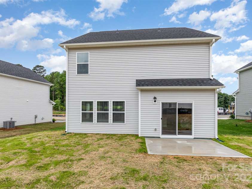 3005 Sadler Woods Lane, Charlotte, NC 28214.  MLS# CAR4272757, YatesRealty ID 20616. Back concrete patio. Representational Photo