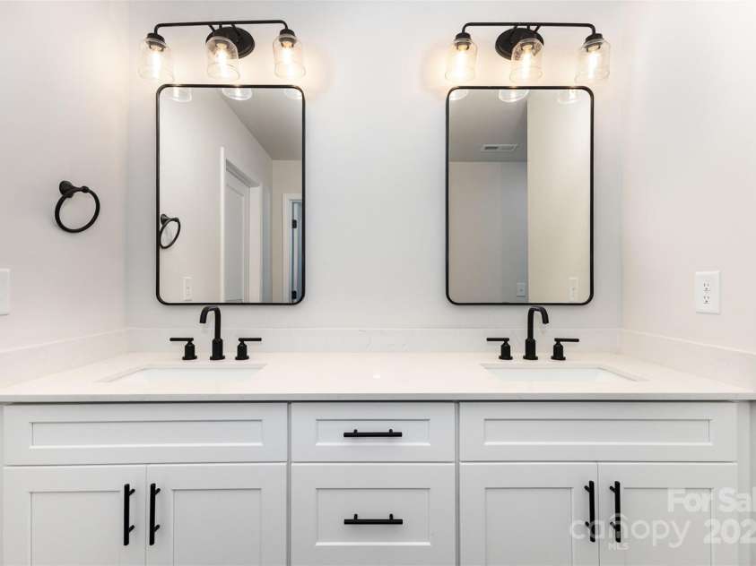 3005 Sadler Woods Lane, Charlotte, NC 28214.  MLS# CAR4272757, YatesRealty ID 20616. Primary bathroom w/ double vanity. Representational Photo.