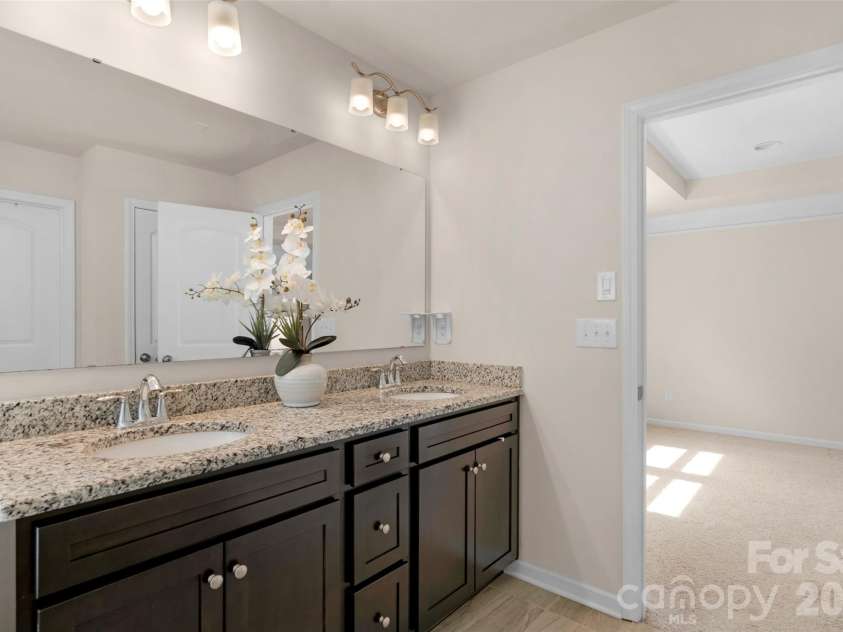 3043 Carriage Oak Way, Fort Mill, SC 29707.  MLS# CAR4374637, YatesRealty ID 20619. Primary bathroom with double sink vanity