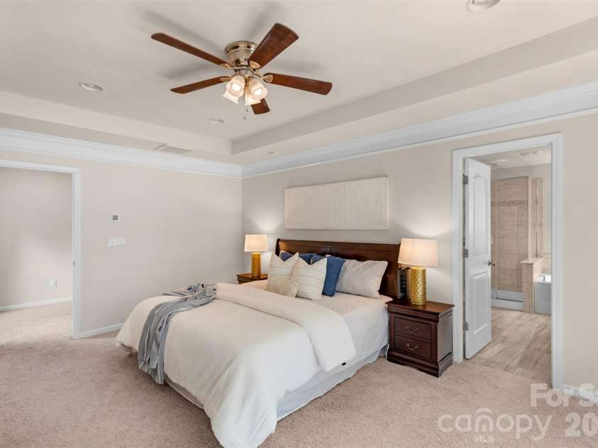 3043 Carriage Oak Way, Fort Mill, SC 29707.  MLS# CAR4374637, YatesRealty ID 20619. Primary bedroom with tray ceiling an en suite