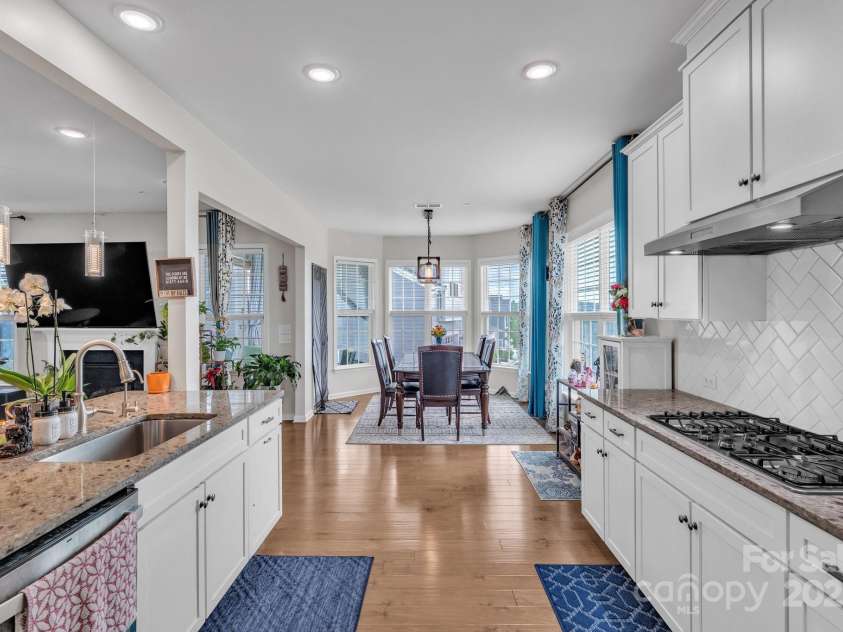 1115 Macallum Drive, Concord, NC 28027.  MLS# CAR4271321, YatesRealty ID 20626. 1st Floor - Kitchen & Dining Area