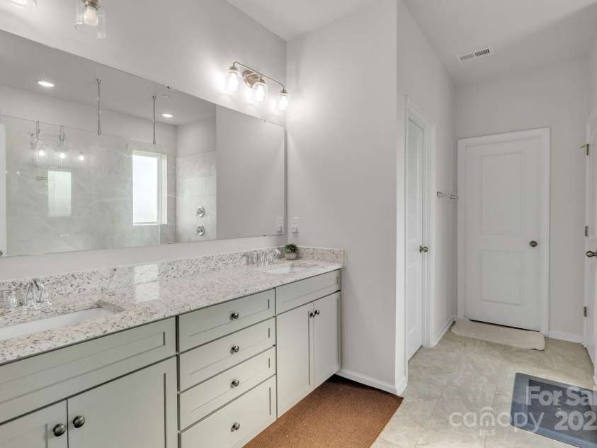 1115 Macallum Drive, Concord, NC 28027.  MLS# CAR4271321, YatesRealty ID 20626. 2nd Floor - Primary Bathroom w/ Standing Shower