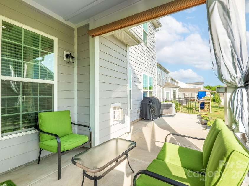 1115 Macallum Drive, Concord, NC 28027.  MLS# CAR4271321, YatesRealty ID 20626. Exterior - Covered Back Patio